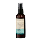 Brown spray bottle with a label on a white background